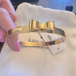 Kate Spade New with Tags gold tone bangle bracelet. Smoke feee home.